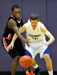 North Kitsap Vikings guard Sheldon Drake battles for the ball against Central Kitsap guard Steffan Collins during action at North Kitsap Monday night.
