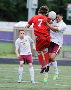 Kingston defender Jose Ramirez battles for the ball during the first half of the West Central District game May 17 against the Franklin Pierce Cardinals.