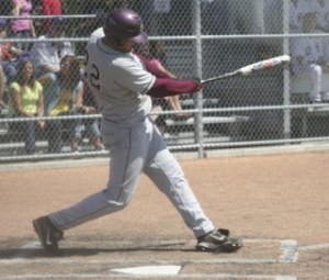 South Kitsap’s Collin Monagle delivers what turned out to be the Wolves’ only hit of the game in a 1-0 loss to Puyallup on Saturday morning.