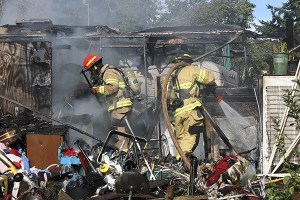 Bremerton firefighters douse an RV on Wycoff Avenue with water. The RV caught fire around 4 p.m. Sept. 8. No one was injured.