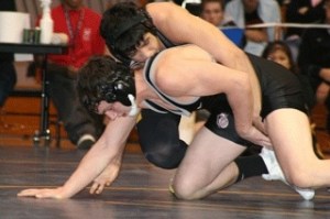 Bremerton's Andres Garcia (top) attempts to control Clinton Coulter of Union in the Class 3A Region III championship match at 189 pounds. Coulter prevailed