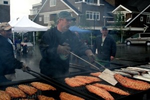 Volunteer cooks keep the salmon coming at the Manchester Salmon Bake on Sunday.
