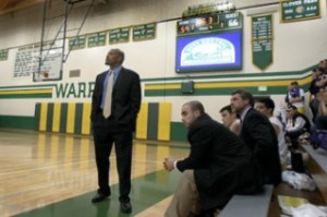 North Kitsap basketball coach Tony Chisholm watches as the final seconds close during playoff action Thursday. The Vikings lost in the first round 60-66.
