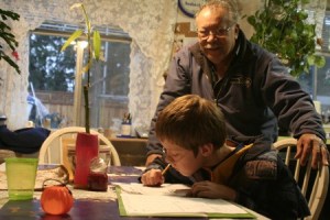 Henry Castanares helps his son Cody