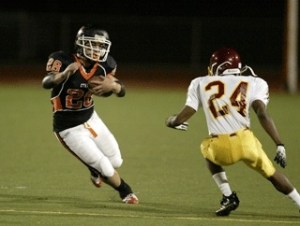 CK running back Howard McDonald makes a move against a Mount Tahoma defender Friday during the Cougars' 35-0 victory on Homecoming Night. McDonald rushed for 193 yards and four touchdowns.