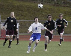 Olympic’s Scott Breeding sets up under the ball against South Kitsap last week.