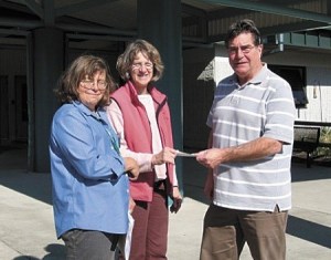 Greater Kingston Kiwanis Club President Dale Rude presents a $7