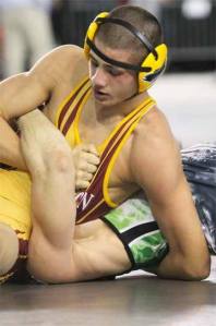 Kingston's Bobby Reece III works for the fall during the championship match against East Valley's Braydan Berezay Feb. 18 in the Tacoma Dome. Reece won his second 2A State wrestling title in the 152-pound division.