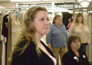 Carmen Bloomfield-Martin watches a bridal fashion show at her new store
