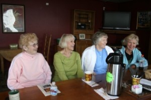 Ray Rohay (far left) meets with her Hansville Solitarian friends on Friday. Senior housing needs is a favored discussion topic.