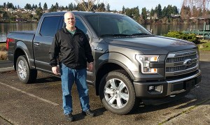 CKSD bus driver Don McConaghy poses with his aluminum-bodied truck.