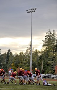 Kingston High football players practiced Tuesday under the new lights at Buccaneer Field.