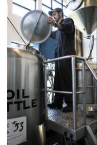 Spencer at work on another batch of one of the brew pubs most famous beers  the Fat Scotch Ale.