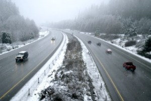 A view from the Trigger Avenue overpass in Silverdale shows slushy road conditions on State Route 3. Local law enforcement and emergency personnel were kept busy as the slippery road conditions led to accidents throughout the day. The National Weather Service calls for rain into the night.