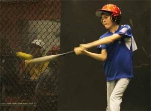 Tyler Meek swings for a ball in The Zone Sportsplex's batting cages in December while going through tryouts for the 2012 Babe Ruth World Series Host team.