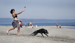 Sherylene McDonald tosses a ball to her dog