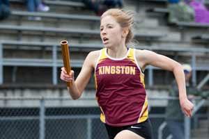 Kingston’s Annie Roberts takes the baton during the 4x400 relay race May 10 during the Olympic League Track and Field Championships at North Kitsap Stadium. Roberts will compete in the 800- and 1