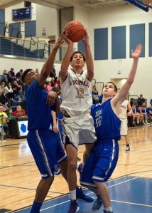 North Kitsap junior Kainen Warren splits the gauntlet for a try against Olympic during the playoff for Olympic league 2A top seed Feb 6 at North Mason High School.