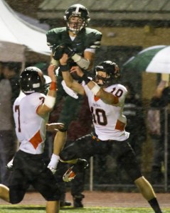 Skyline’s Jordan Simone snags a 25-yard touchdown pass between Central Kitsap defenders Brent McDonald and Brandon Bynum.