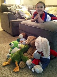 Jordan Barrie poses with his 'babies' that he donated to Oso children. He told his mother he wanted to donate the toys after he saw photos of the mudslide on The Weather Channel.