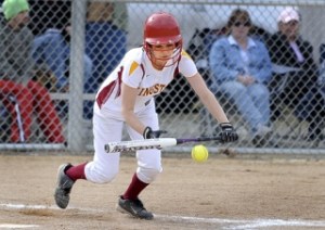 Kingston short stop Hannah Knight lays down a bunt in the second inning of Kingston's win at home against Olympic. Knight ended up with a triple on the bunt