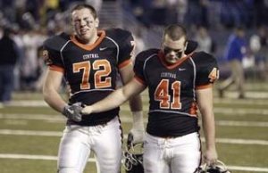 Central Kitsap senior (right) #41 Chris Cole consoles senior teammate (left) #72 Justin Williams as they walk off the field.