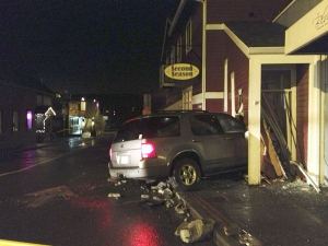 A car crashed into the side of a building at Front and Young streets in downtown Poulsbo late Tuesday.