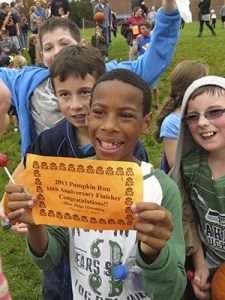 Charrod Tucker shows off his Pumpkin Run certificate.