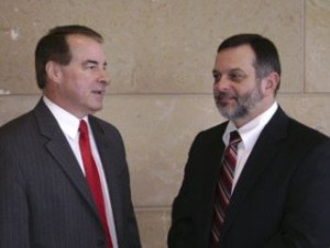 Kitsap County District Court Judge James Riehl (right) welcomes Jeffrey Jahns to the bench.