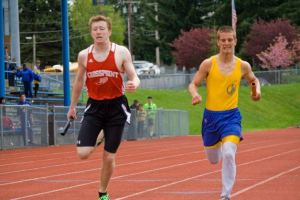 Crosspoint 4x400 relay anchor Jonathan O’Neil and Bremerton’s anchor fight for second place.