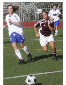 South Kitsap forward Miranda Ness vies for a ball with Olympic defender Gabby Tyner during the Wolves 1-0 nonleague win Tuesday at Silverdale Stadium.