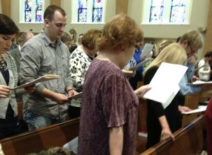 Parish members use temporary missals as 'cheat sheets' until they learn the new translation of Mass.