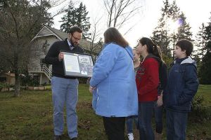 Toby Tebo receives a keepsake from Marilyn Harrelson.