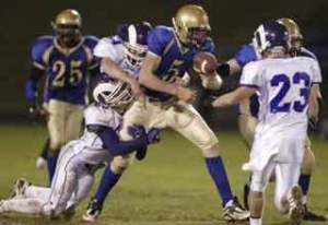 Bremerton quarterback Jacob Belden (5) fumbles the ball against North Thurston on Friday during BHS' Homecoming game. North Thurston won 35-7.