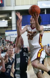 Zane Ravenholt drives for the basket against Squalicum Friday in the Yakima Valley SunDome. Ravenholt led Kingston with 18 points.