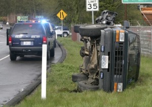A Ford Explorer rests on the shoulder of Bond Road Monday afternoon in Poulsbo.