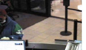 Surveillance at the East Bremerton Chase Bank branch shows Jimi M. Sage during the robbery Oct. 29. He was charged with first-degree robbery and remains in jail on $50