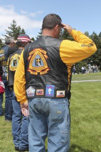 Veterans salute the fallen at a Memorial Day service at Ivy Green Cemetery in Bremerton Monday afternoon.