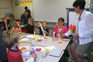 Students at Kitsap Lake Elementary create paper Olympic torches during the school's Summer Olympics learning games.