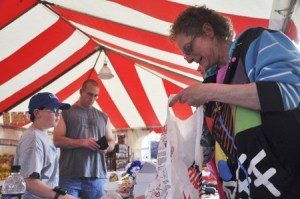 Tia Baines bags fireworks for Walt Lowry and his 9-year-old son