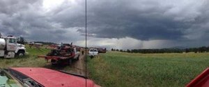 North Kitsap Fire & Rescue firefighters Alex Hickey and Rico LeMay are working with others from Bainbridge Island and Pierce County on a wildland initial attack team in Eastern Washington. This picture was taken just moments before dangerous thunderstorm activity in the area caused the crew to be pulled from working on mop-up after containing the 775-acre Bug Road fire near Tonasket.