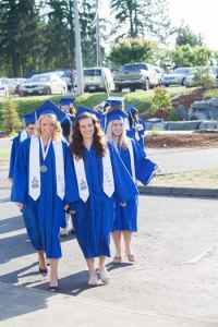 Students filter out of the Presidents Hall as they prepare to begin the procession into the Pavilion.