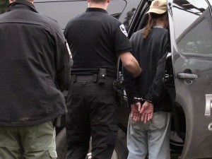 An unidentified man is arrested on suspicion of robbing the Timberland Bank branch on Viking Way