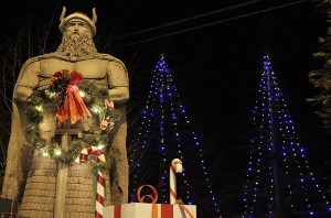 Trees lit behind the 'Norseman' sculpture.