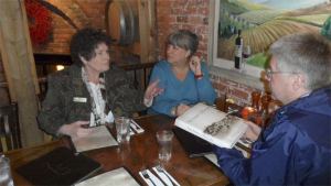 Poulsbo Mayor Becky Erickson talks to Chamber Executive Director Jan Harrison and Capt. Don Johnson about what Poulsbo has to offer visitors.