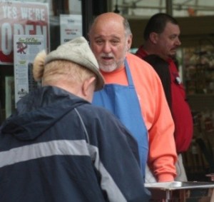 Port Orchard Mayor Lary Coppola greets guests and serves up breakfast during the free pancake feed hosted on Saturday morning at McLendon's Hardware on Mile Hill Drive to mark the start of the Buy It First in Port Orchard program.