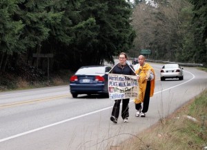 Seth Martin and Buddhist Monk Senji Kanaeda continue their peace walk through Poulsbo.