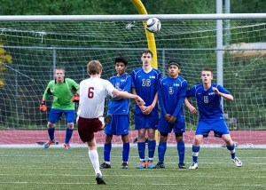 Olympic players defend their net at Kingston.