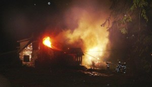 Firefighters battle an East Bremerton blaze Sunday morning. Investigators have ruled the fire arson.