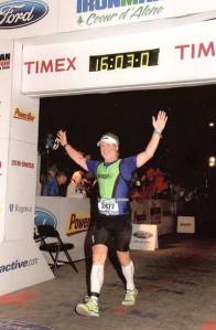 Brian Whelan crosses the finish line during the 2011 Ironman contest at Coeur d'Alene